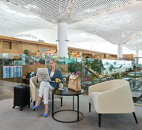 a passenger resting in the comfortable chairs of istanbul airport 