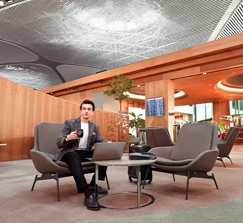 a passenger resting in the comfortable chairs of istanbul airport 